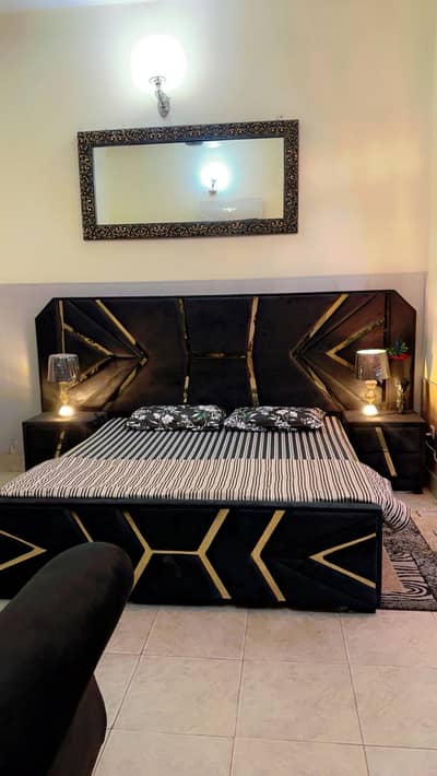 BLACK BED WITH DRESSING AND SIDE TABLE