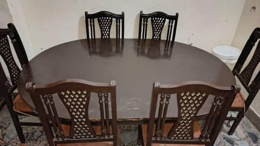 Wooden Dining table with 6 chairs for sale in good condition