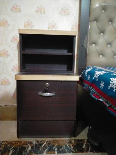 bed set with side tables and a dresser