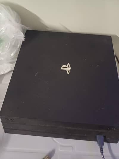 Ps4 pro 1tb with box 8 games 2 controller's