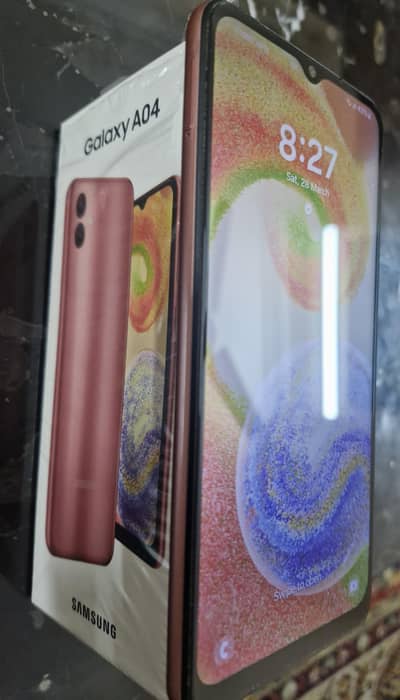 slightly used 10/10 condition samsung A04 mobile with box