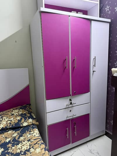 cupboard with study table and book shelf