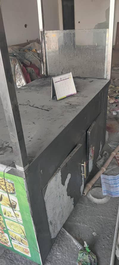 burger counter with 25 kg 2 slender 6 plastic chairs 1 table1burner. . .