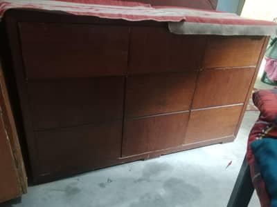 bed with 2 side table and 1 dressing table