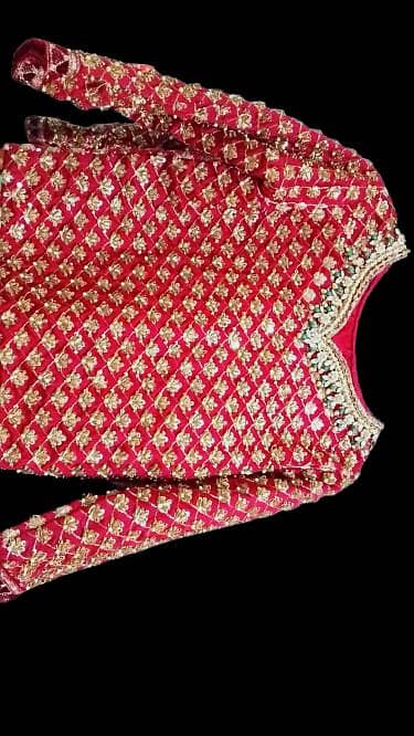 stitched bridal dress. not too heavy to carry. maroon colour.