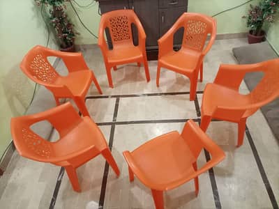 Orange Plastic Chairs – Solid Quality (6 Available)