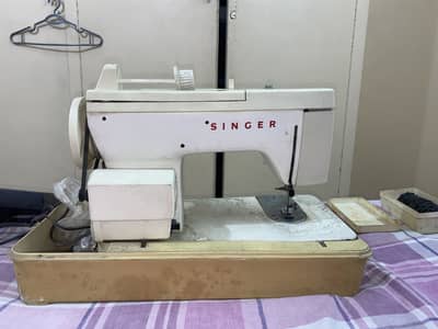 Singer disc sewing machine with stand.