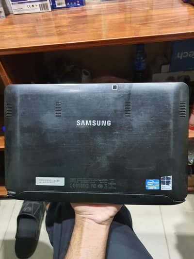 SAMSUNG tablet and a laptop.