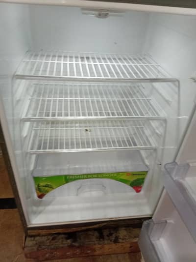 Dawlance hybrid medium size fridge like new warranty card available