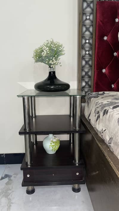 King size bed with two side tables and a sofa