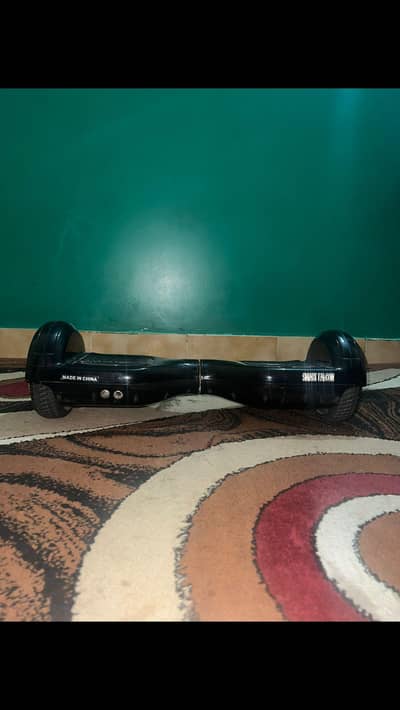 BLACK lMPORTED BALANCE WHEEL WlTH BOX AND CHARGER