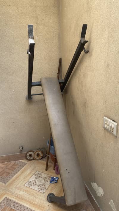 Gym bench plates and rod for sale.