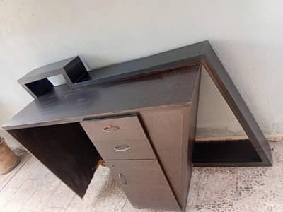 A stylish wooden counter is available for urgent sale.