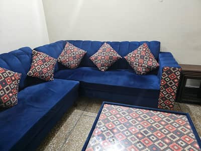 selling a sofa set with table . only used 6 months