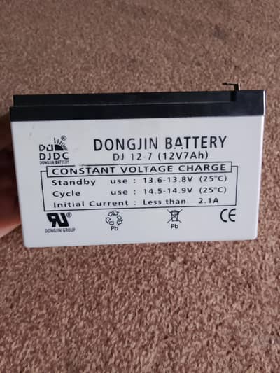 Dongjin battery for sale with charger just like new 12v