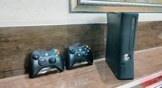 Xbox 360 with two controllers in 27000