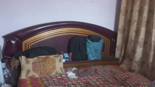 Wooden Bed and drawing Table available in good condition