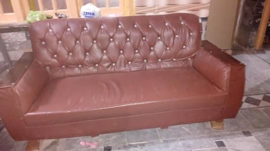 one brown sofa set and table Rs 50 k and white one complete set RS 25k