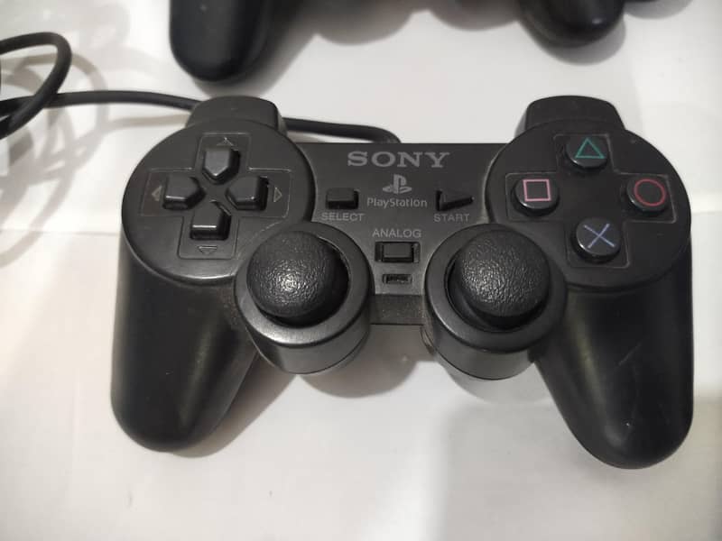 ps2 controller  and 1 ps2 dancing controller 2