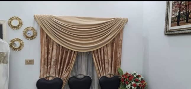 Golden curtains and maroon blinds in 10/10 condition .