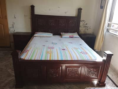 bed and side tables and dressing table
