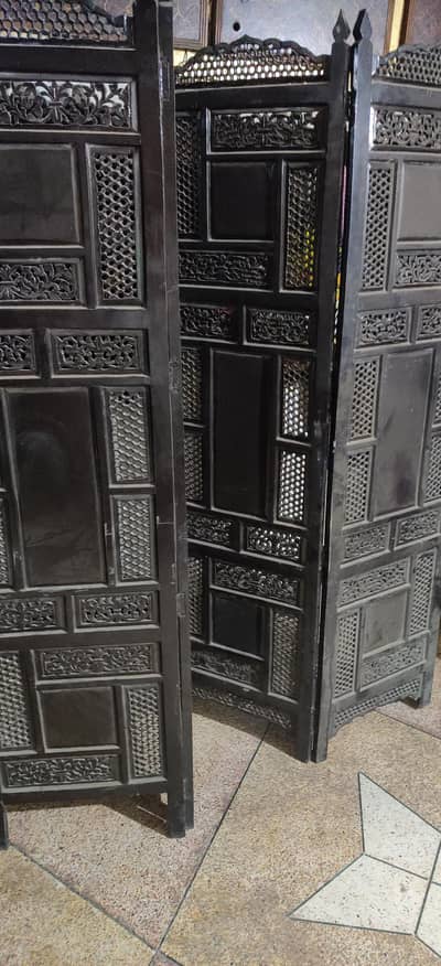 handcrafted black wooden room divider