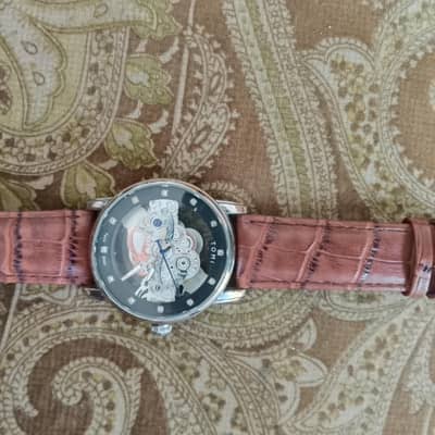 tomi watch glass front and back. leather strap.