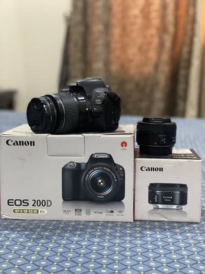 Canon 200D with 18-55mm and 50 mm lenses with original boxes