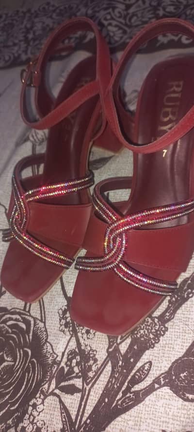 Heels in mahroon colour