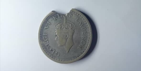 first is one quarter ana 1936 ans second is one rupee india