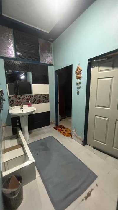 next to main shara e qaideen PECHS block 2 back side Hassan zai koila karahi 200 sq yards Ground floor portion