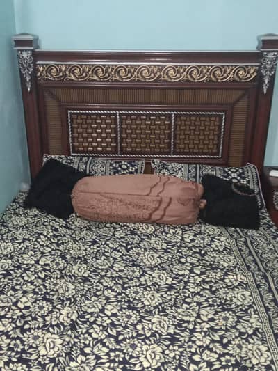 wooden bed with mattress