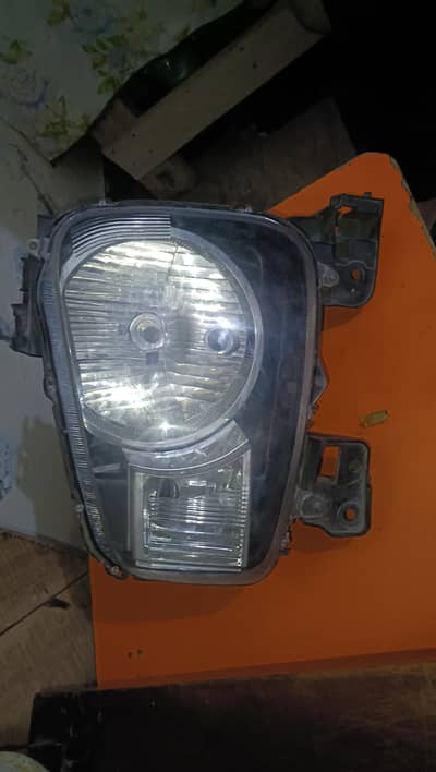 Alto single headlight