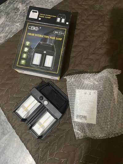 Solar wall light dual bulb with motion senser