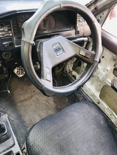 A Toyota Corolla 1986 model is for sale on urgent