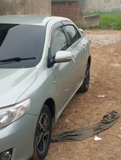 corolla gli 2010 model power stairing alloy rims shimmering green clr