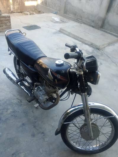 125cc Honda bike with good condition and cleaned and rusting less .