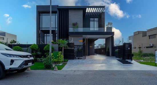 Step into Luxury 1-Kanal Slightly Used Bungalow Featuring Basement, Stylish Interiors, 4-Car Parking, and a Grand Architectural Design in the Heart of DHA Phase 8