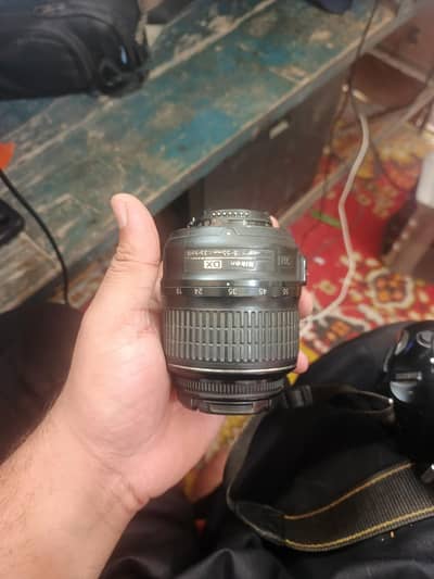 DSLR Nikon d5100 with body lens. . . . .