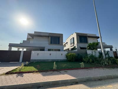 500 Sq Yd Villa For Sale Precinct-4. A+ Construction | 5 Or 6 Beds | Drawing, Dining, Lounge, Modern Kitchen & Greasy Kitchen. Just 3 Min Drive From Main Gate | Near Park, Mosque, Midway Commercial & Bahria Head Office.