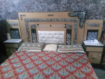 bed with side tables and dressing table