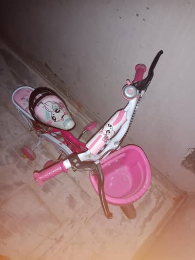 pink cycle n yellow car