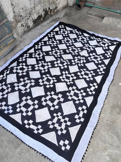 hand-stitched Sindhi Rilli. Stitched by using fabric layer for design