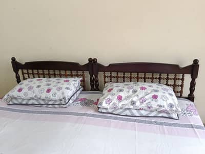 Two single beds of pure wood with Mattresses in perfect condition