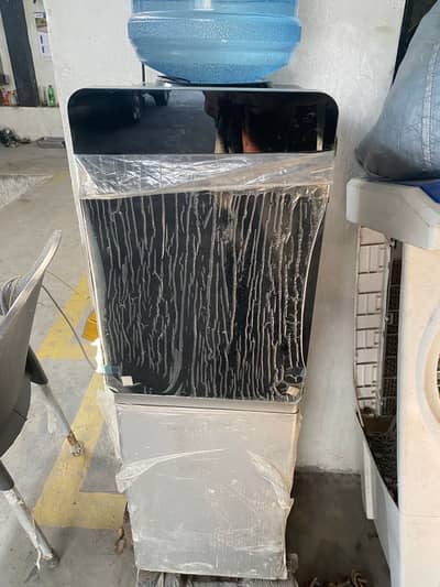 Dawlance water dispenser new condition new model in a  month warranty