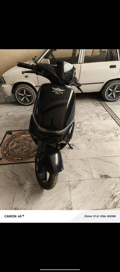 super star electric scooty