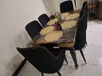 6 seater dining table set marble top and cushioned chairs