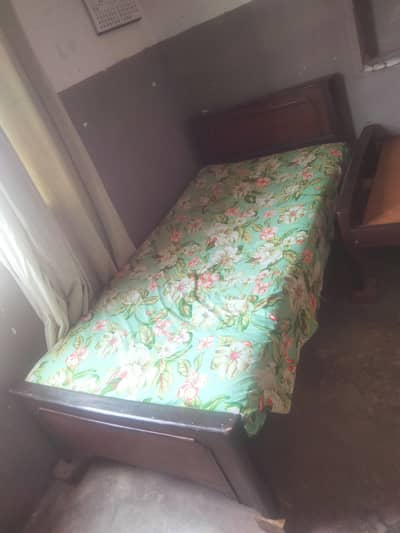 2 same single wooden bed