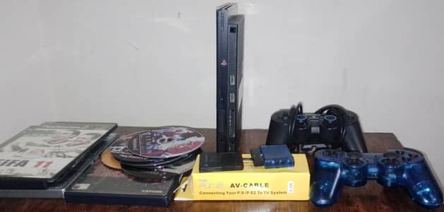 PlayStation 2 slim with it's DVD/CD s