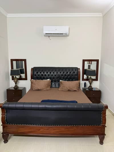 Bed with side tables , console/ mirror , two chairs with coffee table